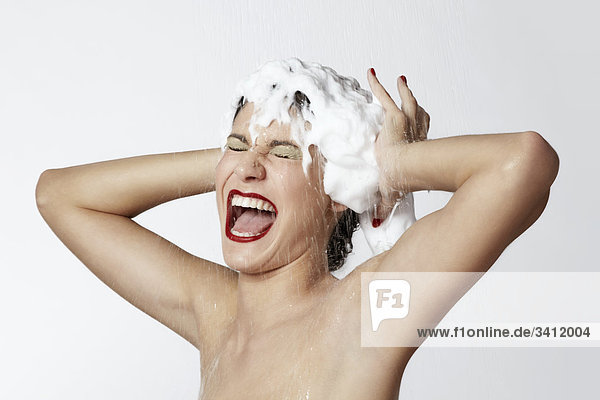 Happy woman with foam in her hair mouth