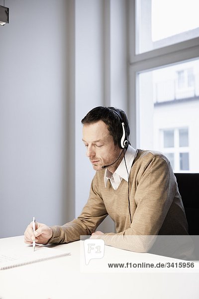 Man with headset in office