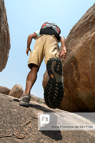 Man hiking in rocky terrain