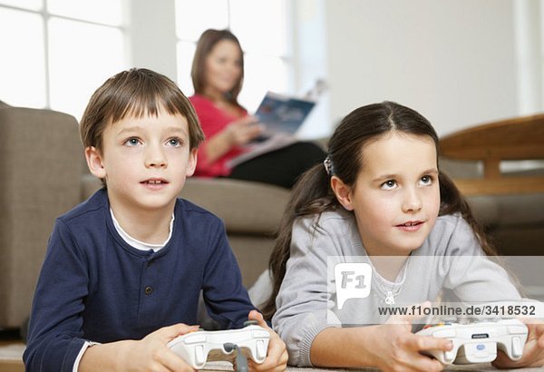 Brother and sister playing videogames
