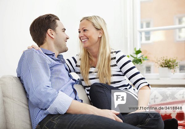 Smiling couple in couch