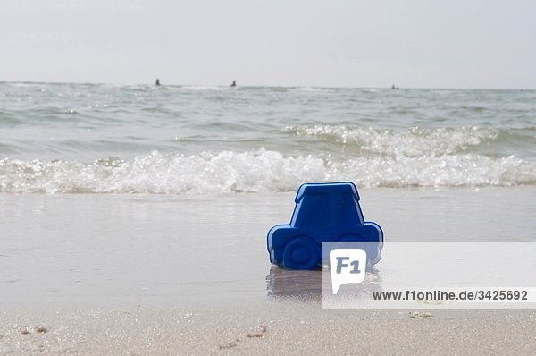 Germany  Schleswig Holstein  Amrum  Plastic car on sandy beach