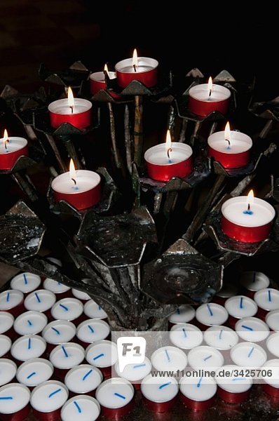 Italy  Venice  Lit candle lights in church  close-up