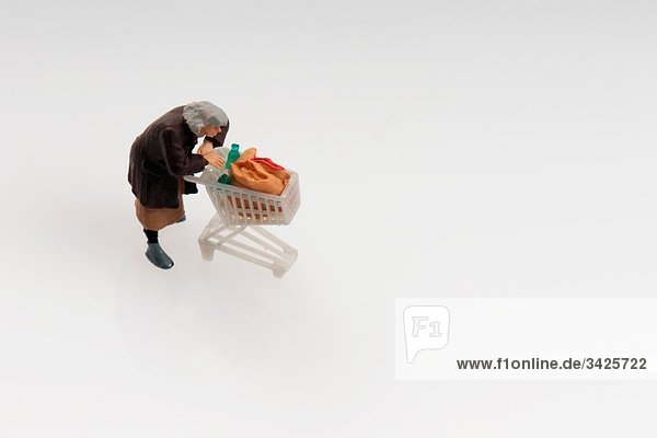 Plastic figurine with shopping cart