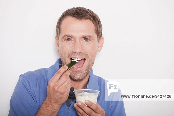 Man eating icecream  portrait  close-up