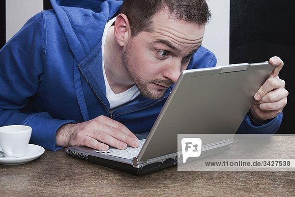 Man staring at laptop