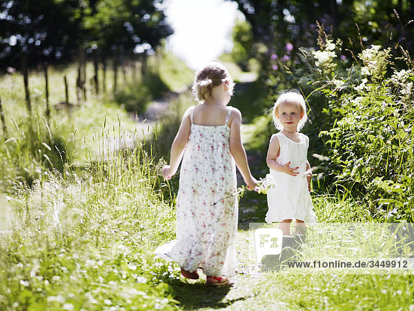Girls playing in meadow