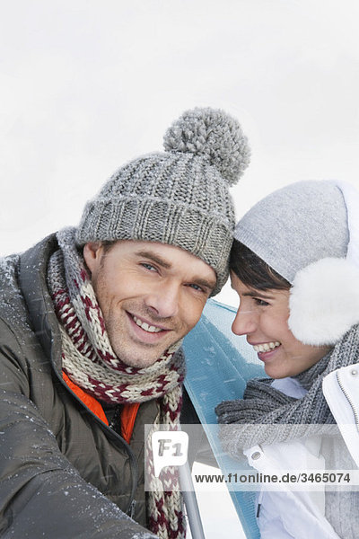 Young couple in winter clothes embracing