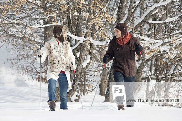 Young couple snowshoeing
