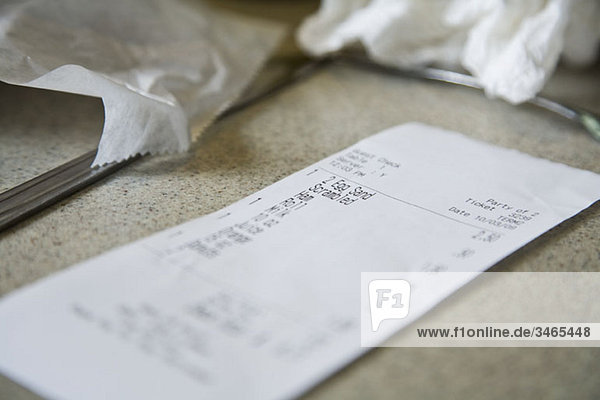 Detail of a cafe receipt on a counter