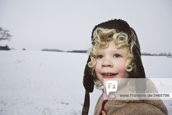 A boy outdoors in winter  head and shoulders  portrait