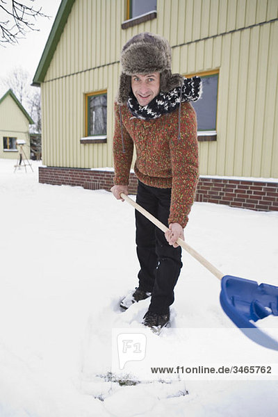 A man shoveling snow