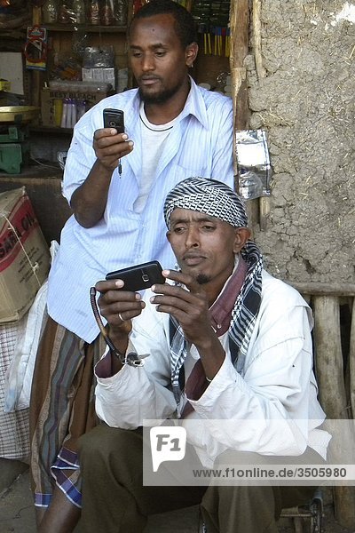 Africa  Ethiopia  men with cell phone                                                                                                                                                               