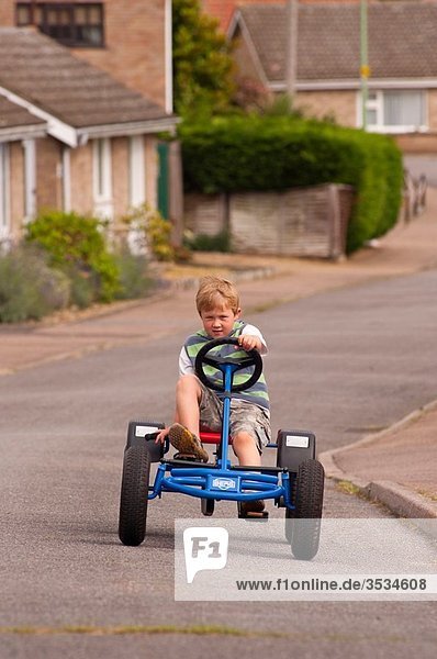 A Model Released five year old boy on a Berg go cart in the Uk