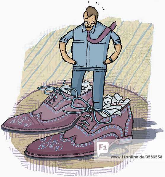 Mann steht in großen Schuhen