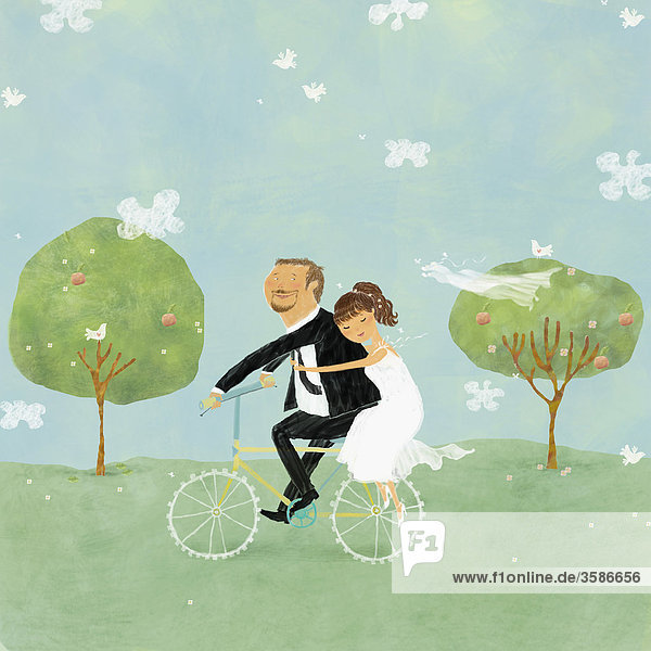 Bride and groom on bicycle in park