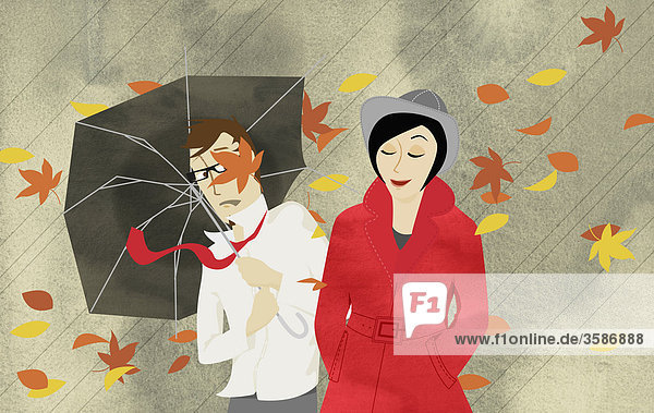 Mann und Frau in Herbststurm