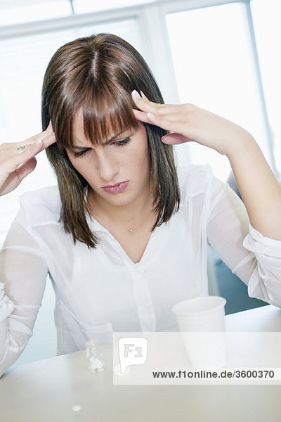 Businesswoman suffering from a headache