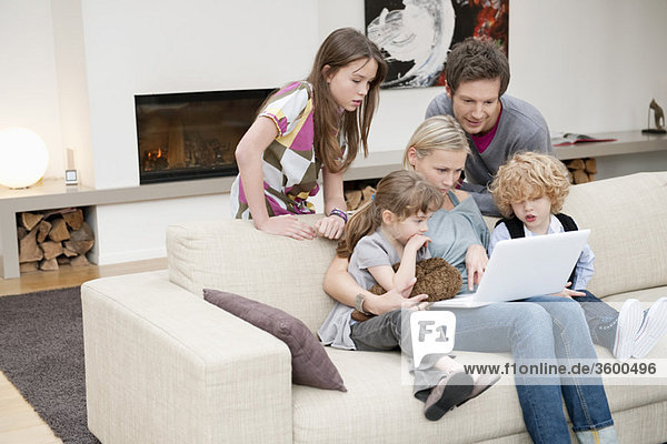 Family using a laptop