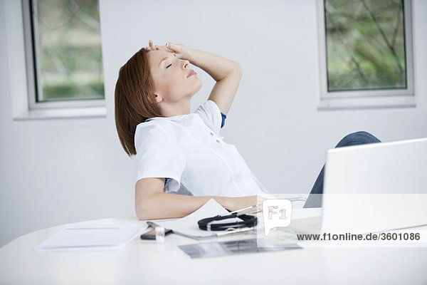 Female doctor resting in an office