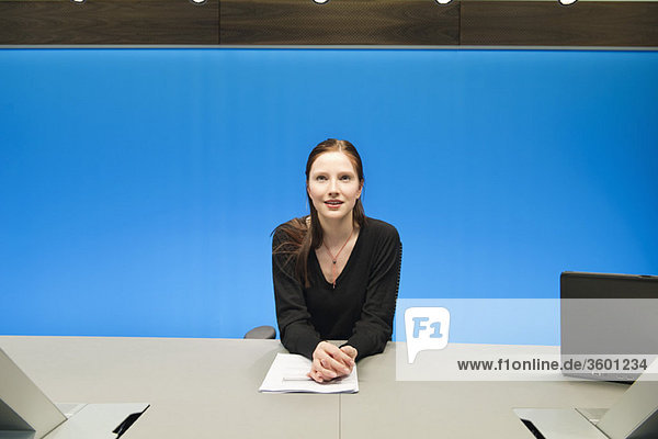 Businesswoman doing paperwork in a conference room