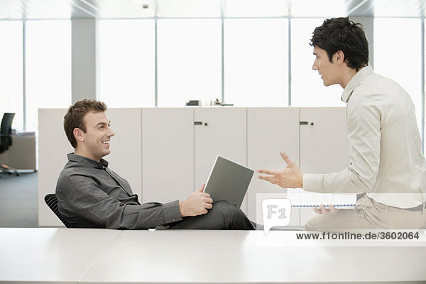 Two businessmen working in an office