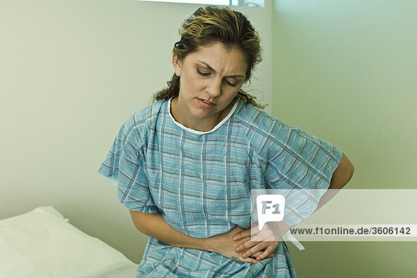 Female patient experiencing severe abdominal pain