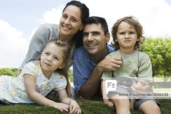 Family relaxing together outdoors  portrait