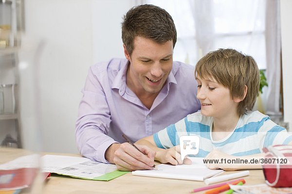 Father and son doing homework