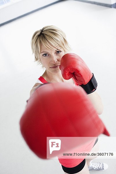 Woman boxing into camera