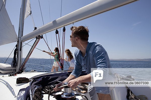 Team setting sail on yacht