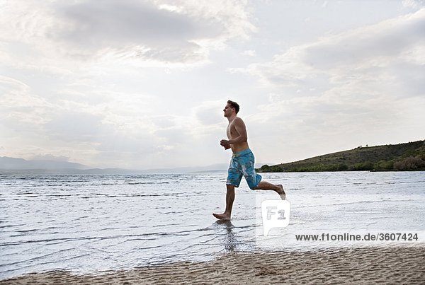 Man running at beach