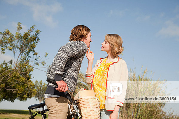 Young couple and bicycle
