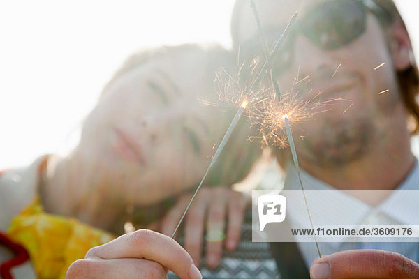 Young couple with sparklers