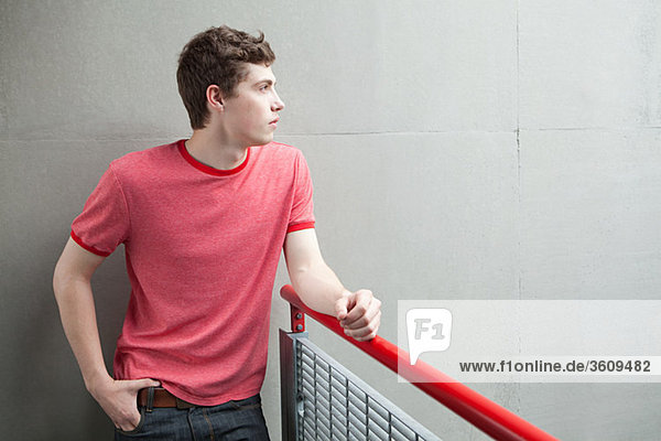 Young man by railing