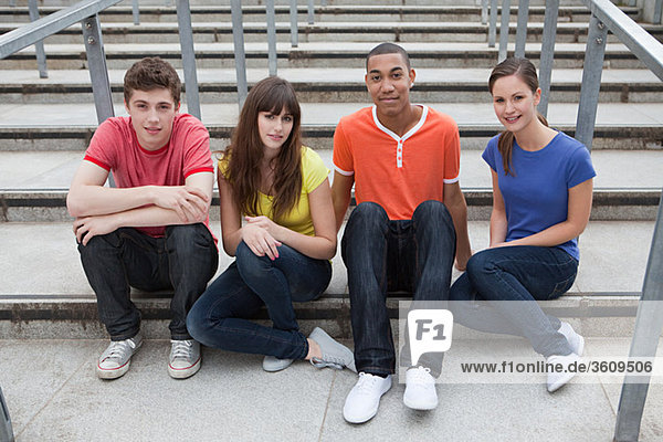 Young people sitting on steps