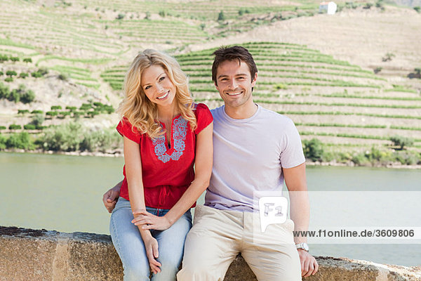 Couple sitting by douro river
