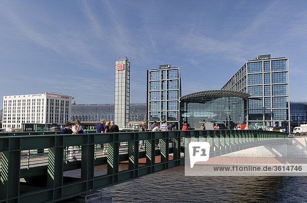 Architecture  railway station  station building  building  Berlin  bridge  Germany  Europe  river  flow  rivers  flows  pedestrian  footbridge  building  construction  body of water  central station  people  people  passers-by  person  persons  rail traffic  Spree  day  water  outside  German  outdoors  outside  European  moulder  during  day