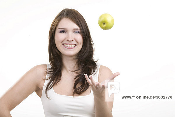 Woman throwing an apple