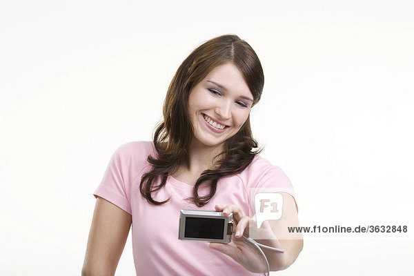 Young woman with digital camera