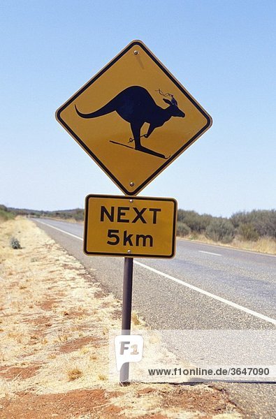 Quirky addition to an outback road sign in the Northern Territory of Australia