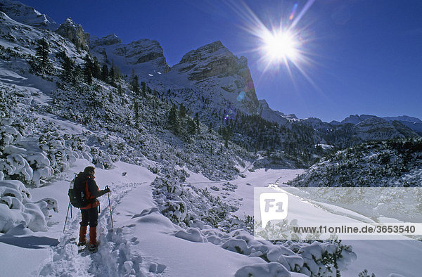 Snowshoe walker at Valun Campestrin in the Fanes group  Val Badia  South Tyrol  Dolomites mountains  Italy  Europe
