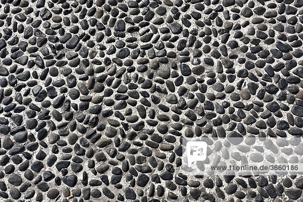 Natursteinpflaster Textur  kleine schwarze Vertiefungen
