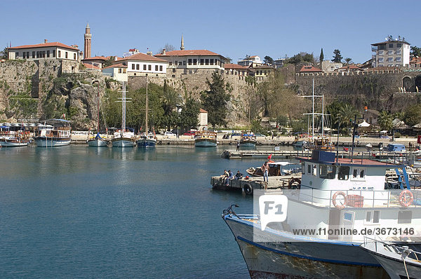 Antalya at the south coast Turkey the harbour with the historic city center and the tower of the Yivil Minare