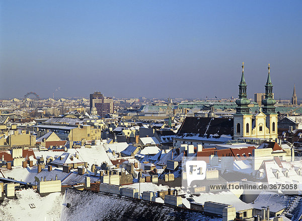 View from the Stephans cathedral over Vienna in winter with the Riesenrad at the left Vienna Austria