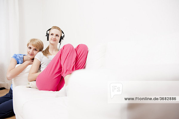 Young women listening to music