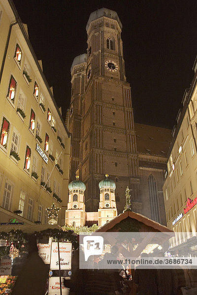 Christmas market on pedestrian precinct Munich with cathedral Bavaria Germany