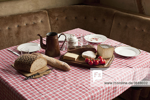 A simple rustic meal laid out on a set table