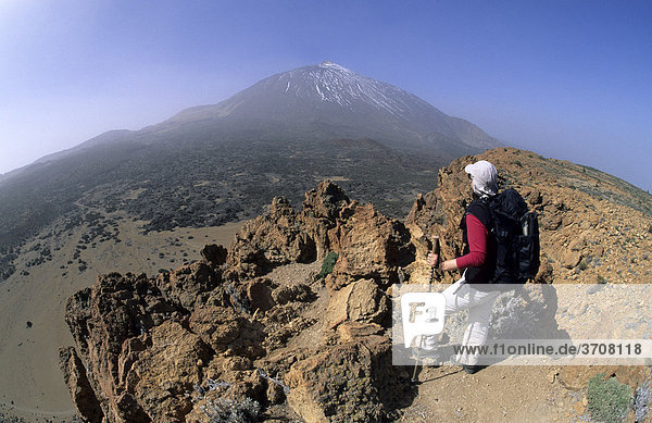 Wanderin on the summit of the Fortaleza  2159m  in the back Mt. Pico del Teide  3718m  Tenerife  Canary Islands  Spain  Europe