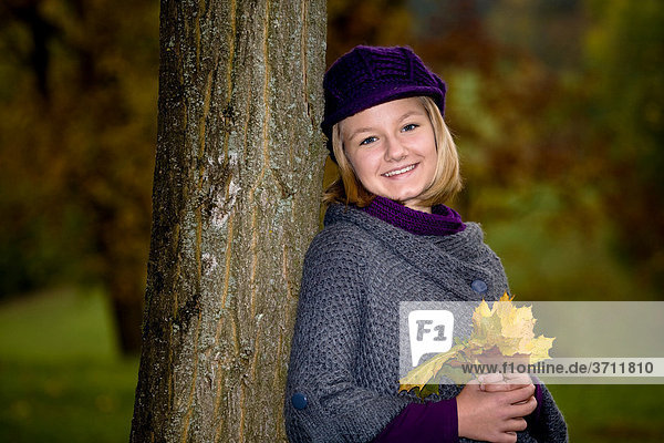 Girl  13  in a park in autumn